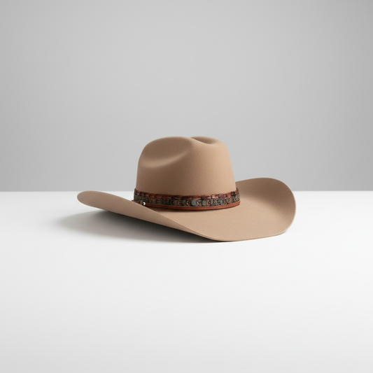 Tan hat with leather band on simple backdrop