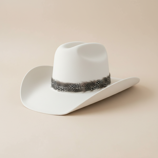White hat with spotted feather band on simple backdrop